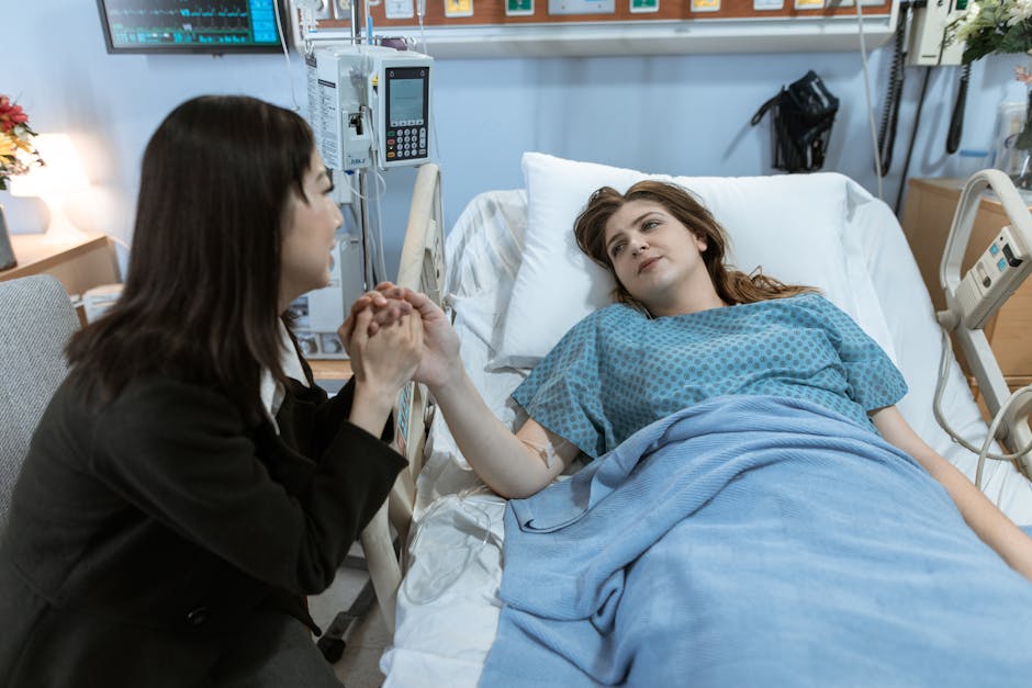 A comforting hospital visit with a patient receiving support from a friend